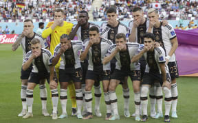Germany players cover their mouths. Protest versus the ban on wearing the One Love captain's armband. World Cup 2022.