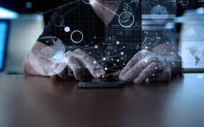 Data appearing above a mobile phone.