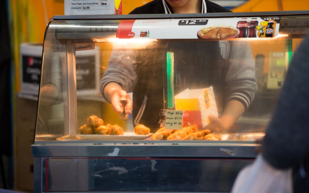 Fried chicken being served up at a takeaway in Mangere Town Centre