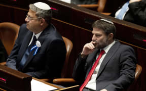 Israeli right-wing Knesset member Itamar ben Gvir (L) and Bezalel Smotrich (R) are pictured during the swearing in ceremony of the new Israeli government at the Knesset (Israeli parliament) in Jerusalem, in 2022.