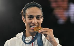 Boxing gold medallist Algeria's Imane Khelif poses on the podium