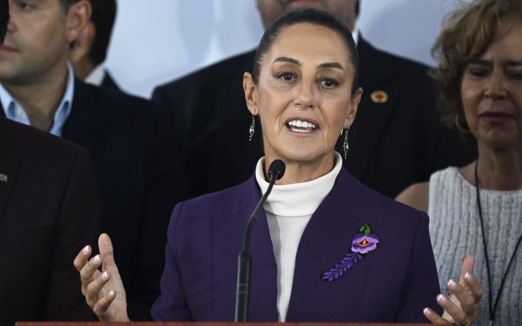 Mexico's presidential candidate for the Morena party Claudia Sheinbaum speaks on her arrival to attend the third presidential debate ahead of the June 2 national elections in Mexico City, on May 19, 2024. (Photo by Alfredo ESTRELLA / AFP)