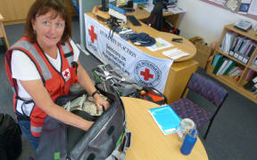 Volunteer nurse Donna Collins prepares her gear to head to Kathmandu.