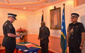 Matthew Varley is sworn in as Solomon Islands police commissioner.