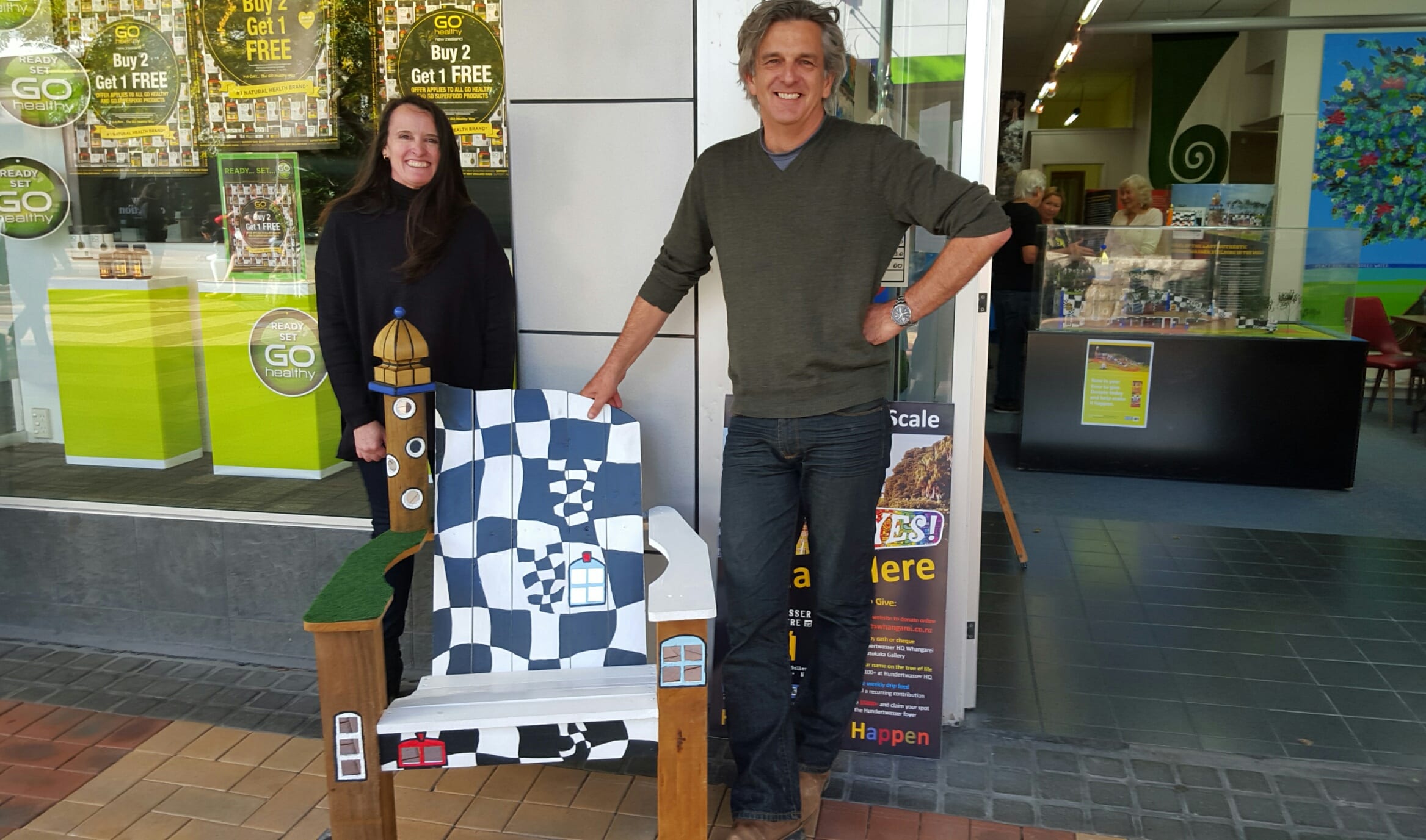 Chief fundraiser for the Hundertwasser project Helen Whittaker with her ppioular chair creation and project director Andrew Garratt.