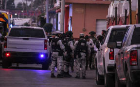 Members of the National Guard and army soldiers arrive at the crime scene where Gisela Gaytan (out of frame), candidate for mayor of Celaya for the National Regeneration Movement party (MORENA), was gunned down during a campaign rally in San Miguel Octopan, Celaya, Guanajuato state, Mexico on April 1, 2024. A mayoral candidate in the central Mexican state of Guanajuato was murdered on April 1, 2024, amid a wave of violence against local politicians during the election season. She was Gisela Gaytán, who was seeking the mayoralty of Celaya for the Morena party, confirmed Alma Alcaraz, a candidate for the same party to govern Guanajuato. (Photo by Oscar Ortega / AFP)