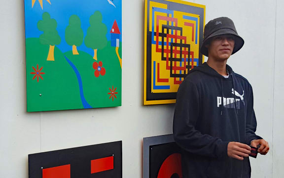 Nathan Cole with his art