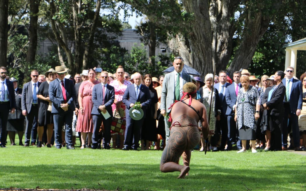 Politicians, including Prime Minister Chris Hipkins and opposition leader Christopher Luxon, being welcomed onto Te Whare Runanga on the Treaty grounds at Waitangi.