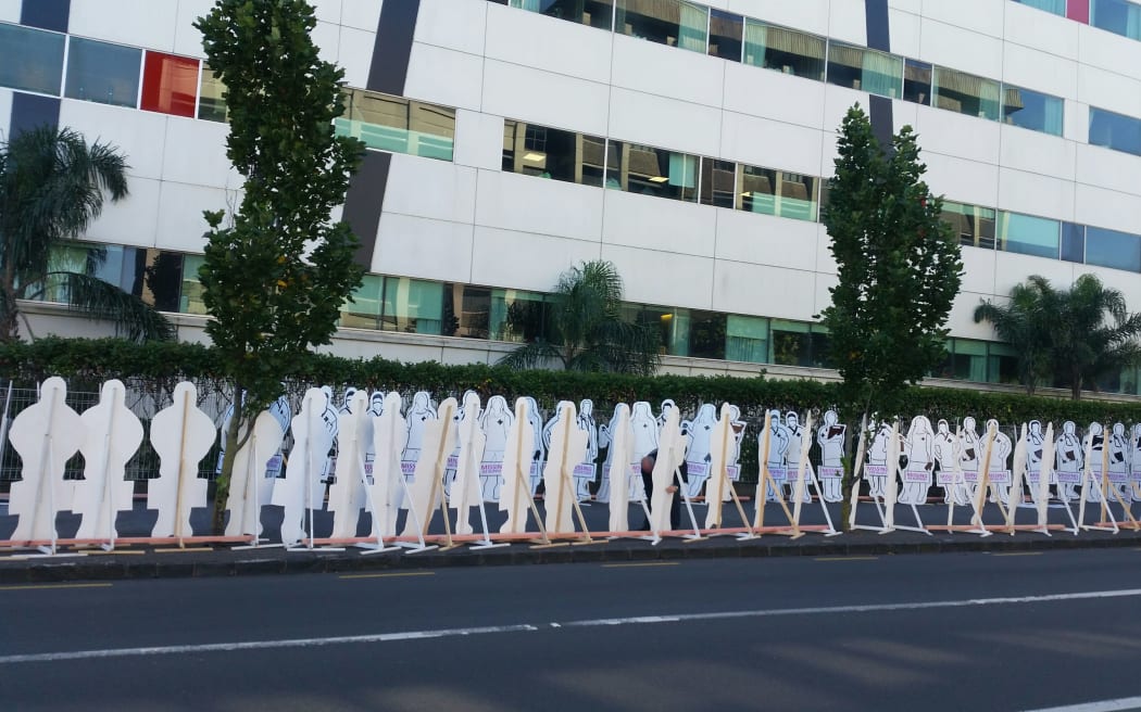 Protesters placed silhouettes representing staff they say were planned for by Auckland's three DHBs but not employed