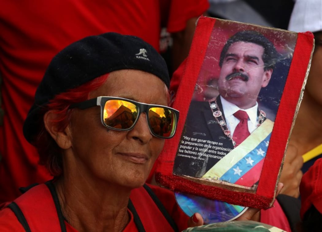 CARACAS, VENEZUELA - MARCH 10 : People gather in front of the Miraflores Palace during a meeting  in support of Venezuelan President Nicolas Maduro, in Caracas,  on March 10, 2019.