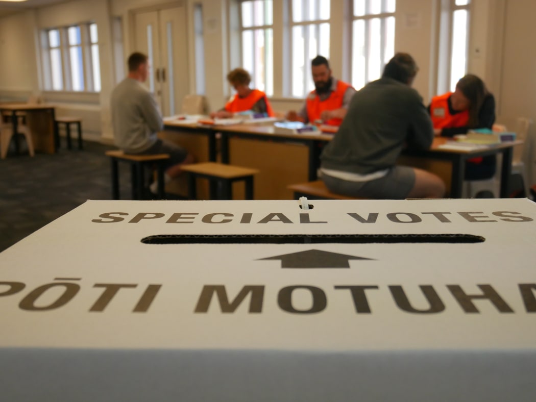Prisoners at Christchurch Men's Prison being given voting papers by Electoral Commission staff.