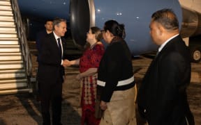 Antony Blinken is greeted by Tongan officials upon arrival to Fua'amotu Airport.
