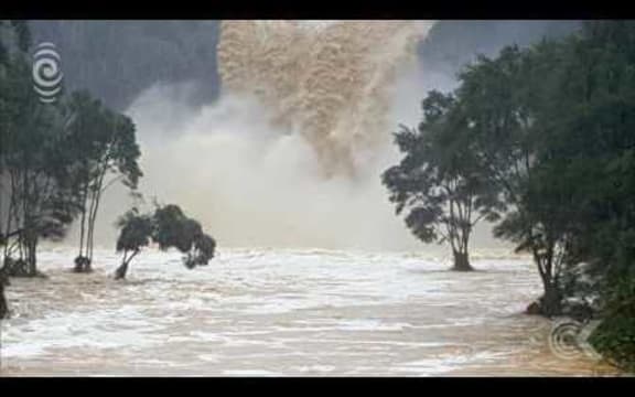 Flooding closes roads, cuts power to thousands