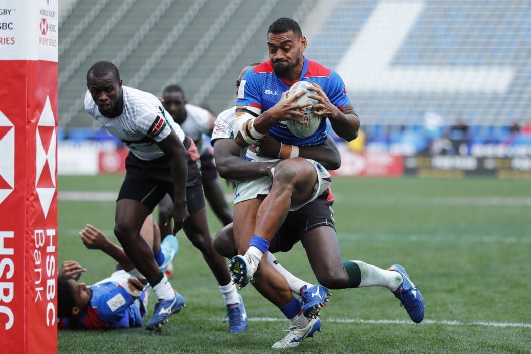 Samoa's David Afamasaga drives through the Kenya defence for a try during the ninth place quarter final clash.