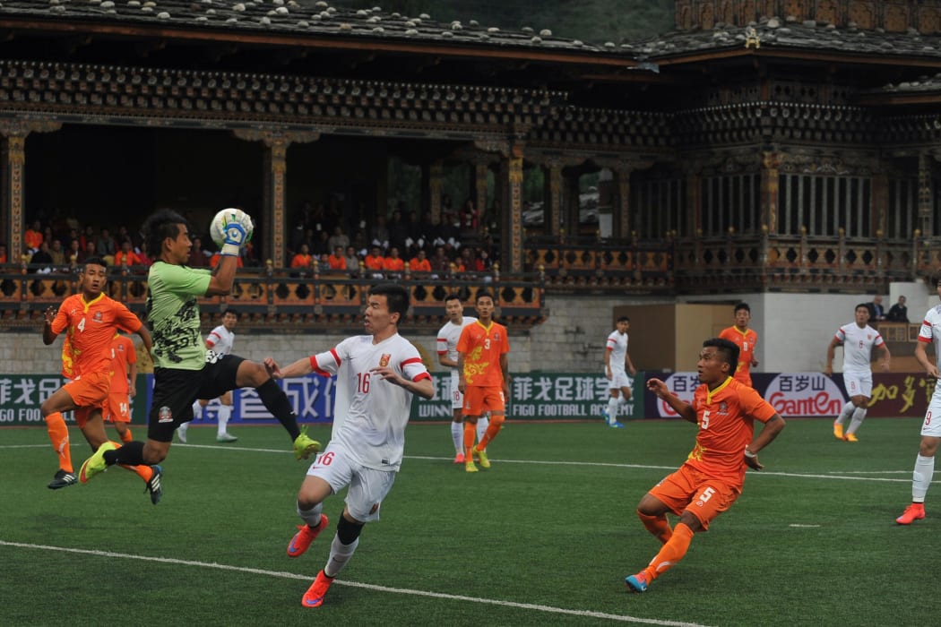 Bhutan and China contest a 2018 FIFA World Cup qualifying match at the Changlimithang Stadium in Thimphu in 2015.