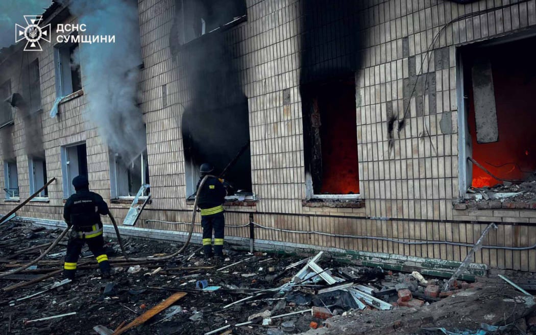 This handout photograph released by the State Emergency Service of Ukraine on March 19, 2025, shows firefighters extinguishing a fire in a hospital building following a strike in Krasnopillya, Sumy region, amid the Russian invasion of Ukraine. (Photo by Handout / STATE EMERGENSY SERVICE OF UKRAINE / AFP) / RESTRICTED TO EDITORIAL USE - MANDATORY CREDIT "AFP PHOTO / STATE EMERGENCY SERVICE OF UKRAINE " - NO MARKETING NO ADVERTISING CAMPAIGNS - DISTRIBUTED AS A SERVICE TO CLIENTS
