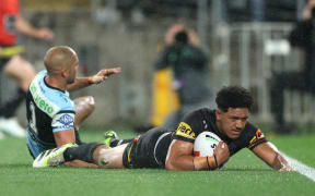 SYDNEY, AUSTRALIA - SEPTEMBER 28:  Paul Alamoti of the Panthers scores a try during the NRL Preliminary Final match between the Penrith Panthers and the Cronulla Sharks at Accor Stadium on September 28, 2024 in Sydney, Australia. (Photo by Mark Metcalfe/Getty Images)