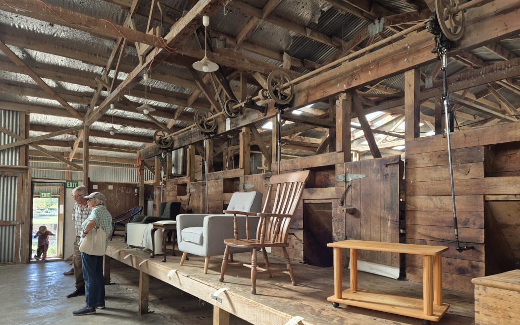 Inside the woolshed, a range of household items and furniture, including several arm chairs, was also on offer at the auction.