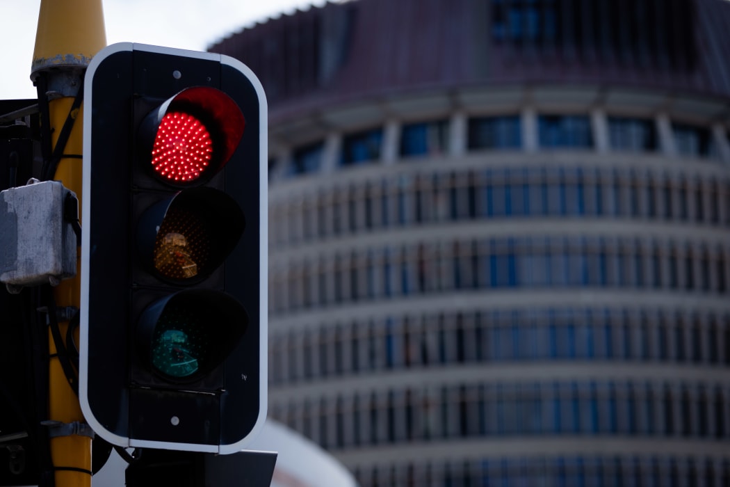 Red traffic light on front of Parliament