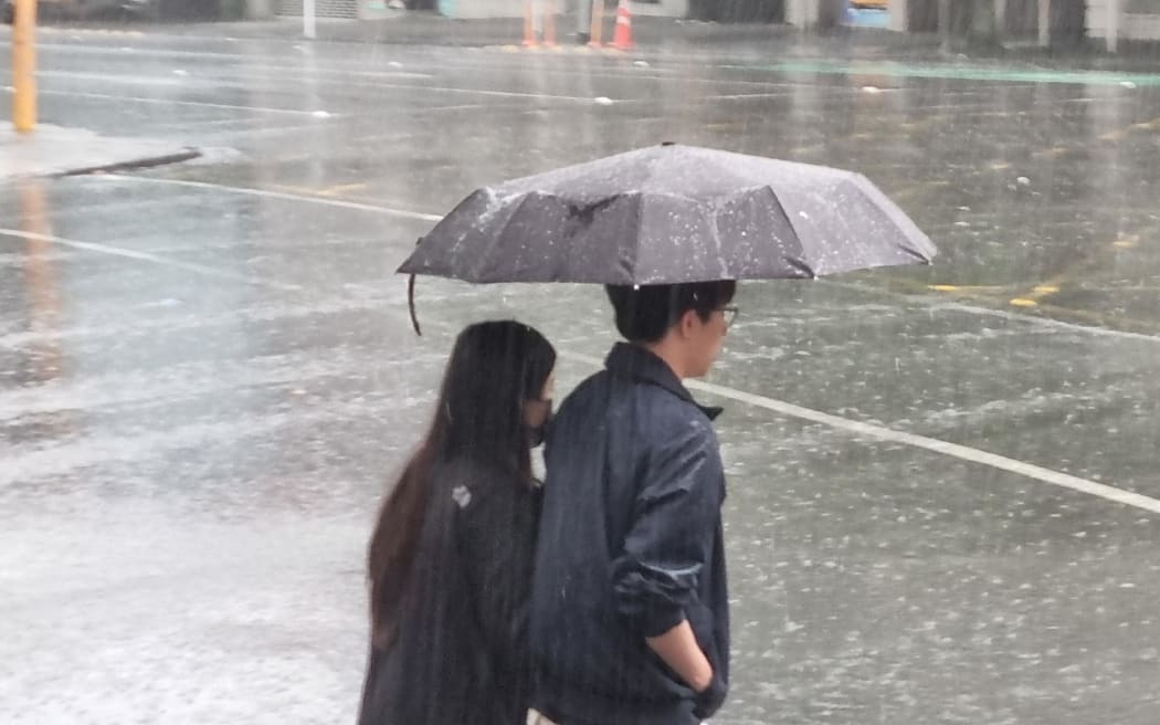 Heavy rain falling in Auckland city.