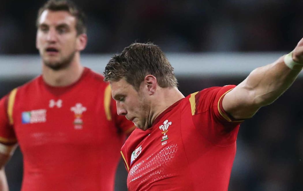 Wales’ first-five Dan Biggar kicks a penalty in the win over England.
