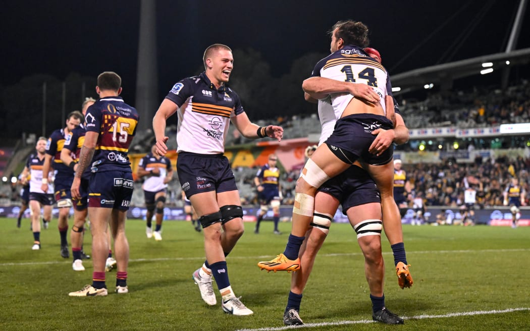 Andy Muirhead of the Brumbies celebrates with team mates after scoring a try during the Super Rugby Pacific quarter-final win over the Highlanders in Canberra.