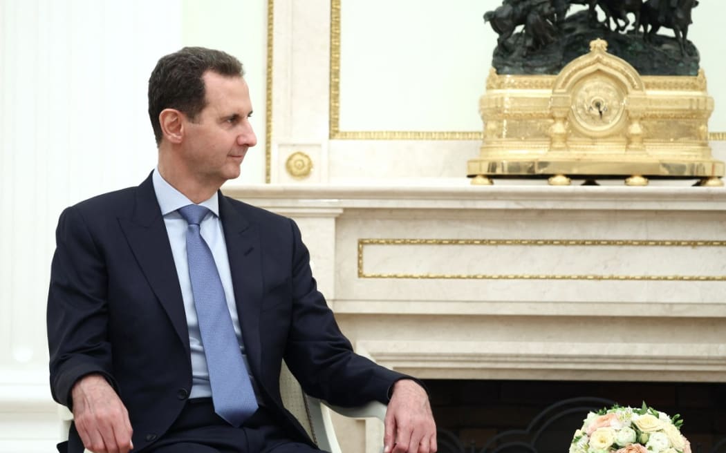 In this pool photograph distributed by the Russian state agency Sputnik on July 25, 2024, Syria's President Bashar al-Assad meets with Russian president at the Kremlin in Moscow on July 24, 2024.