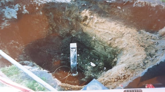 An old photo Daveena Dawrant has collected shows her garden dug up and remediation works, where an abandoned well was discovered.