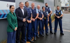 Rotorua Mayor Tania Tapsell, Police Minister Mark Mitchell, area commander Inspector Herby Ngawhika, Bay of Plenty District Commander Superintendent Tim Anderson, Senior Community Constable, Tony O’Keeffe (far right) along with other local officers at Rotorua police station.