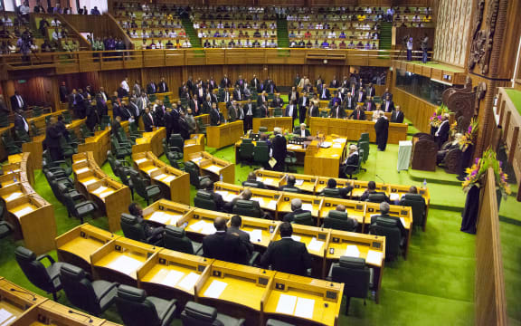 Members of parliament stand to the right of the speaker (R) to approve the vote of Peter O'Neill as prime minister in Port Moresby on August 3, 2012.