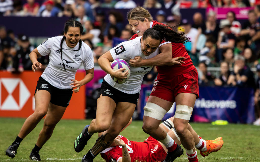 Black Ferns player Portia Woodman-Wickliffe tries to break a tackle against Canada.