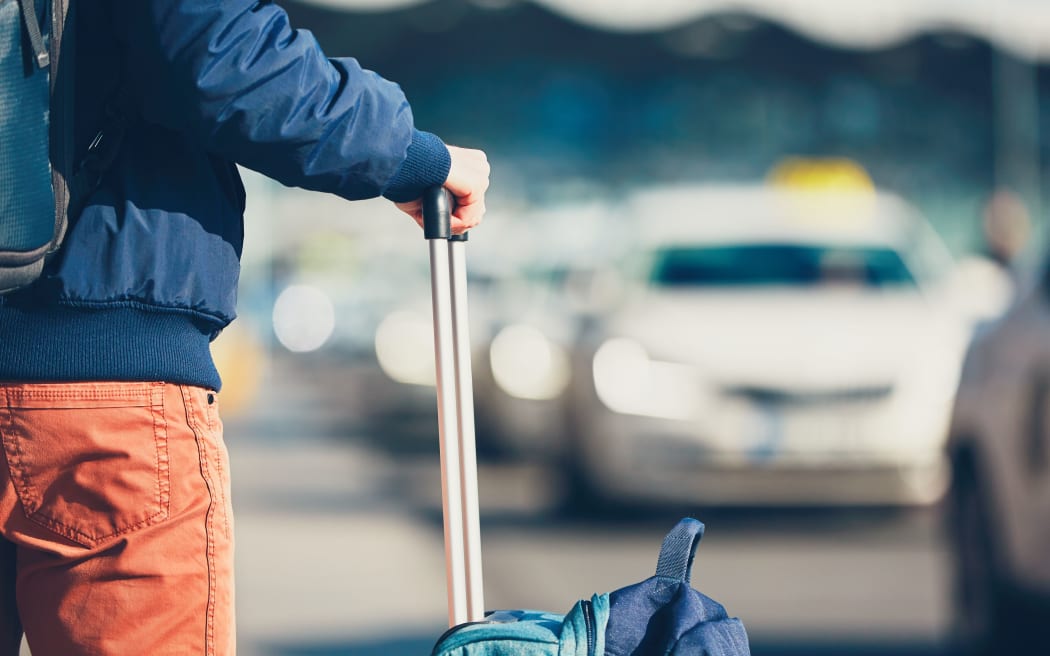 A passenger waiting for a taxi.