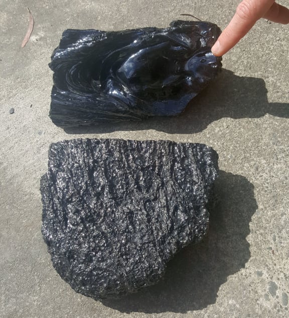 A piece of lava poured in the Lava Lab and a piece of real lava cut out of a Hawaiian lava flow.