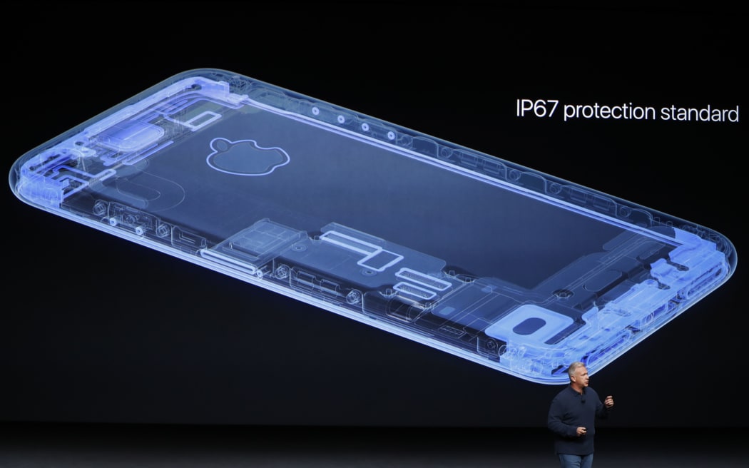 Apple senior vice president of worldwide marketing Phil Schiller unveils the new Apple iPhone 7 during a launch event in San Francisco, California.