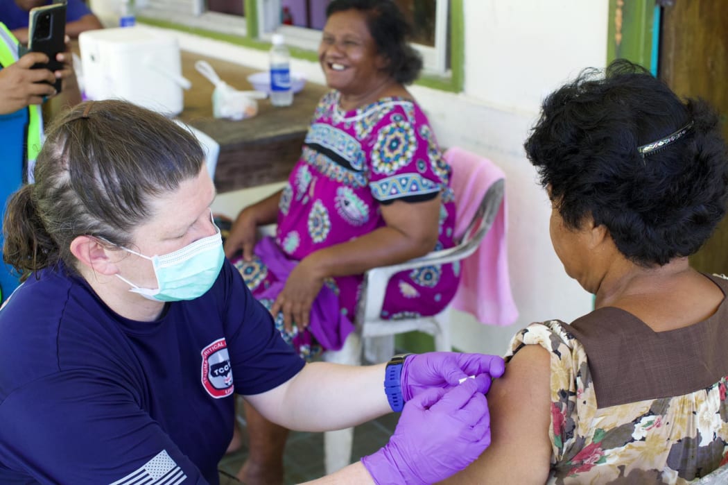 US Health officials administer the Johnson & Johson vaccine in Kayangel State