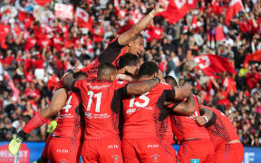 Tonga celebrate a try.