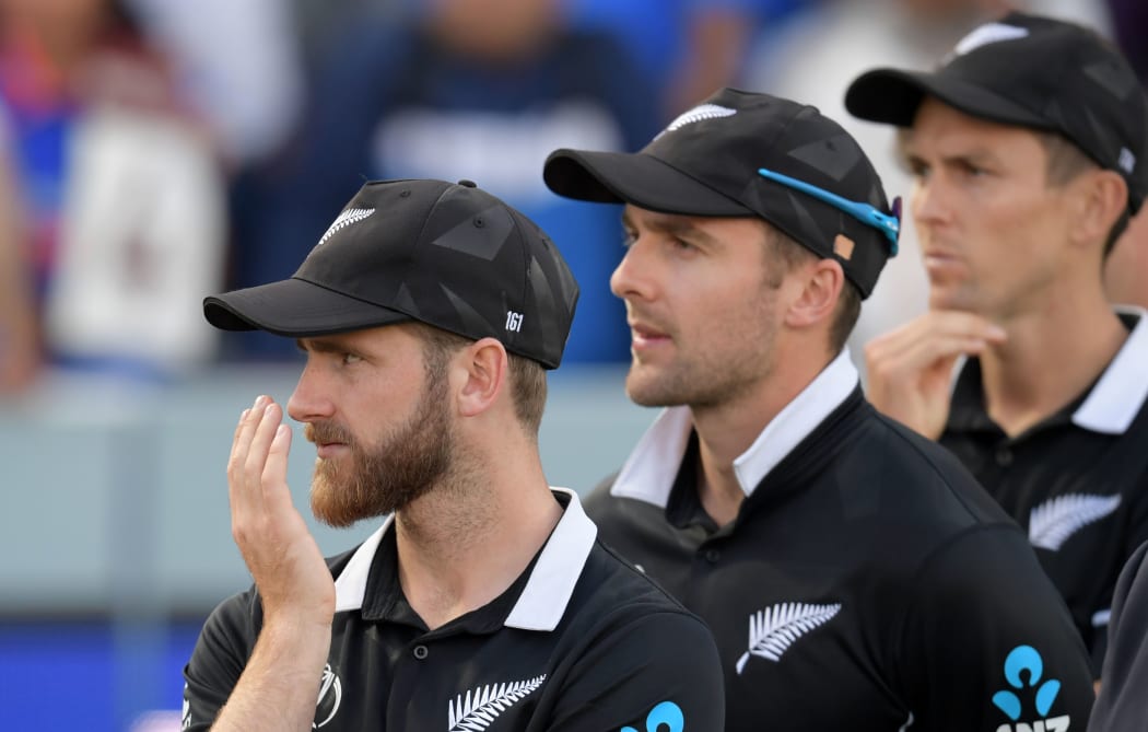 New Zealand's captain Kane Williamson (L) looks on at the trophy presentation after defeat in the 2019 Cricket World Cup final between England and New Zealand at Lord's Cricket Ground in London on July 14, 2019.