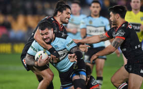 Tohu Harris tackling Cronulla's Andrew Fifita.