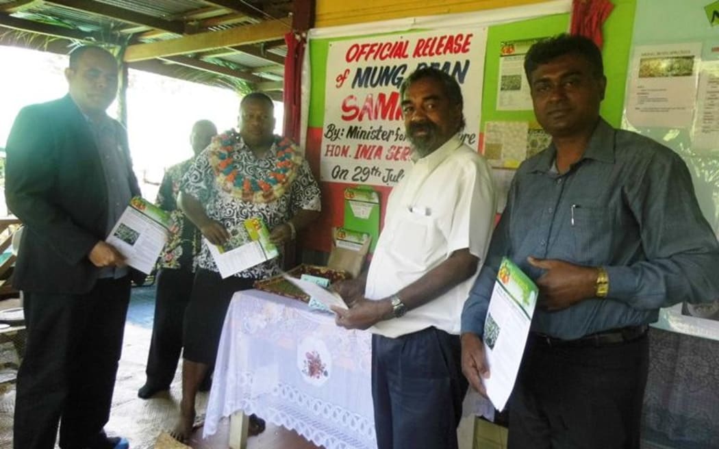 Fiji's agriculture minister, Inia Seruiratu, with staff at the launch of a new variety of Mung Bean.