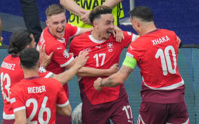 Switzerland celebrate a goal to Ruben Vargas (C) during their 2-0 win over Italy at Euro 2024.