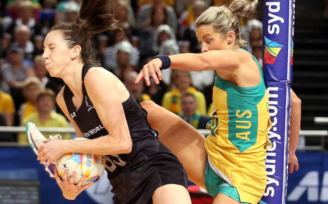 The Silver Ferns Baily Mes grapples with Australia's Julie Corletto