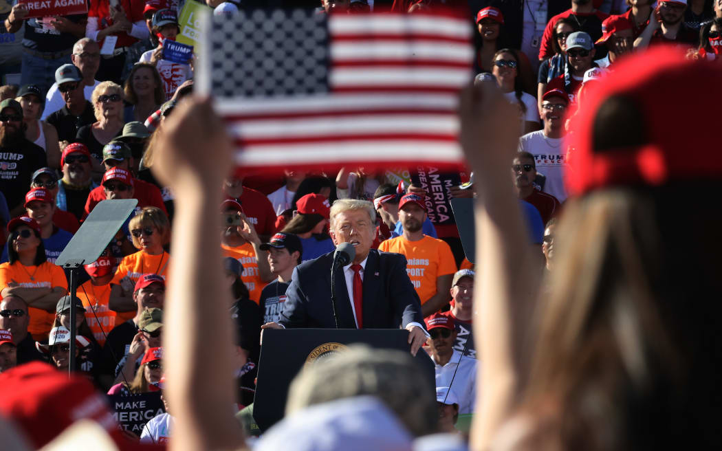 US President Donald Trump addresses thousands of supporters during a campaign rally at Phoenix Goodyear Airport October 28, 2020.