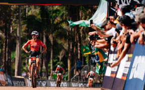 Sammie Maxwell crossing the line in round two of the UCI mountainbike world series in Araxa, Brazil.