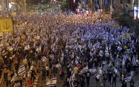 Protesters take part in ongoing demonstrations against the government's judicial reform bill in Tel Aviv on 8 April, 2023.