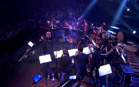 Mark Almond and musicians performing in the BBC Proms David Bowie tribute.