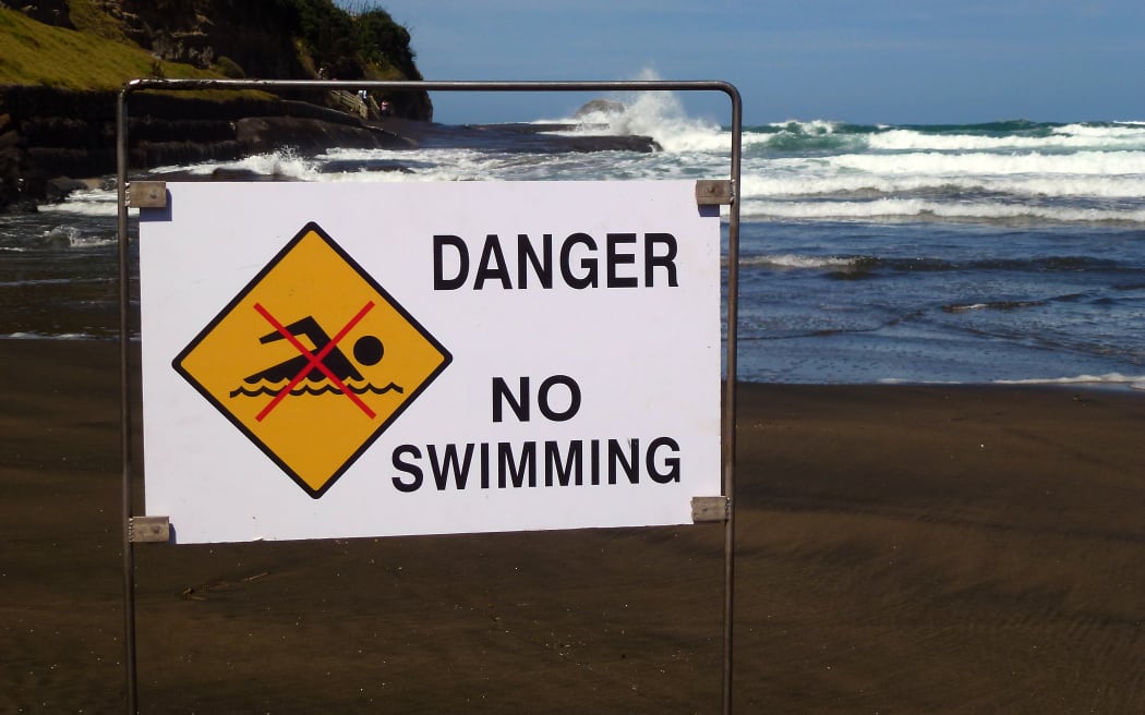 040314. Photo Todd Niall  / RNZ. Muriwai Beach, Auckland. No swimming sign