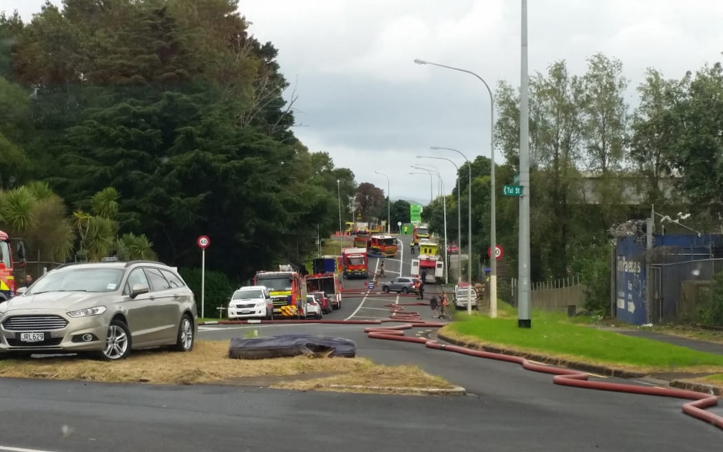 Fire trucks on James Fletcher Drive. They are fighting a fire at a scrap metal yard in Favona.