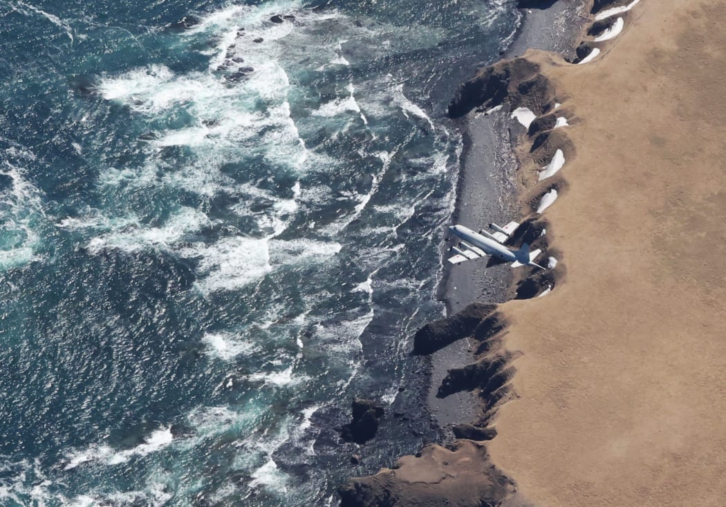 A plane searches for missing persons around Shiretoko Peninsula in Shari Town, Hokkaido Prefecture, northern Japan.