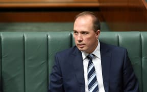 Australian Immigration Minister Peter Dutton reacts during House of Representatives Question Time at Parliament House in Canberra, Monday, Nov. 9, 2015.