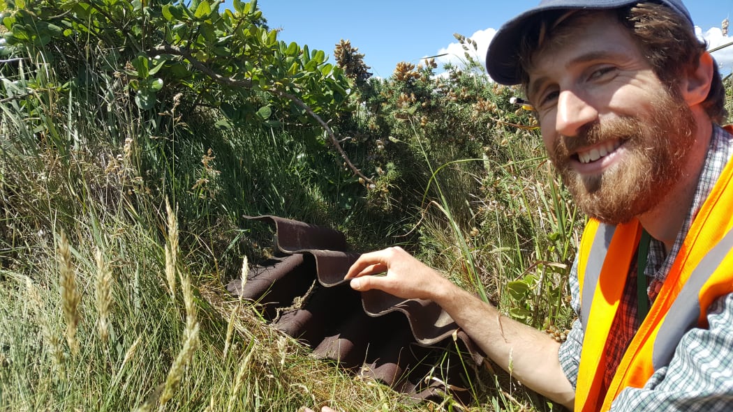Chris Woolley  and a stack of Onduline used as an artificial cover object.